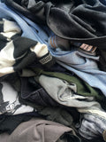 Pile of vintage denim and shirts