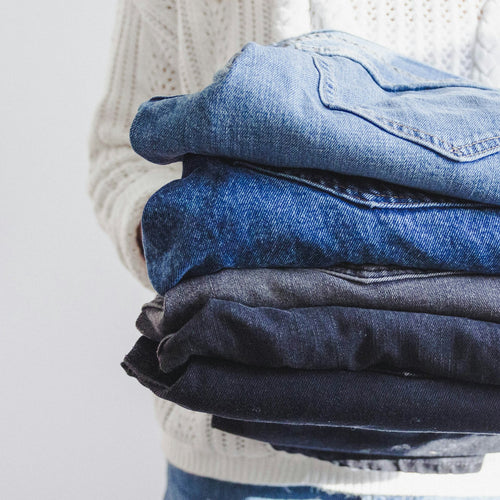 Stack of folded branded jeans