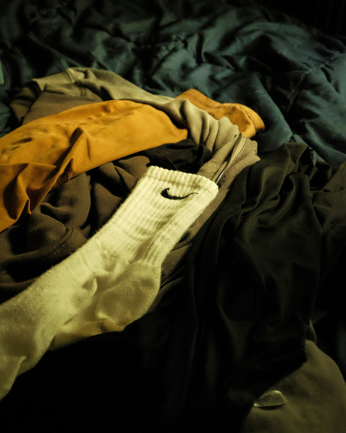 Pile of mixed branded clothing
